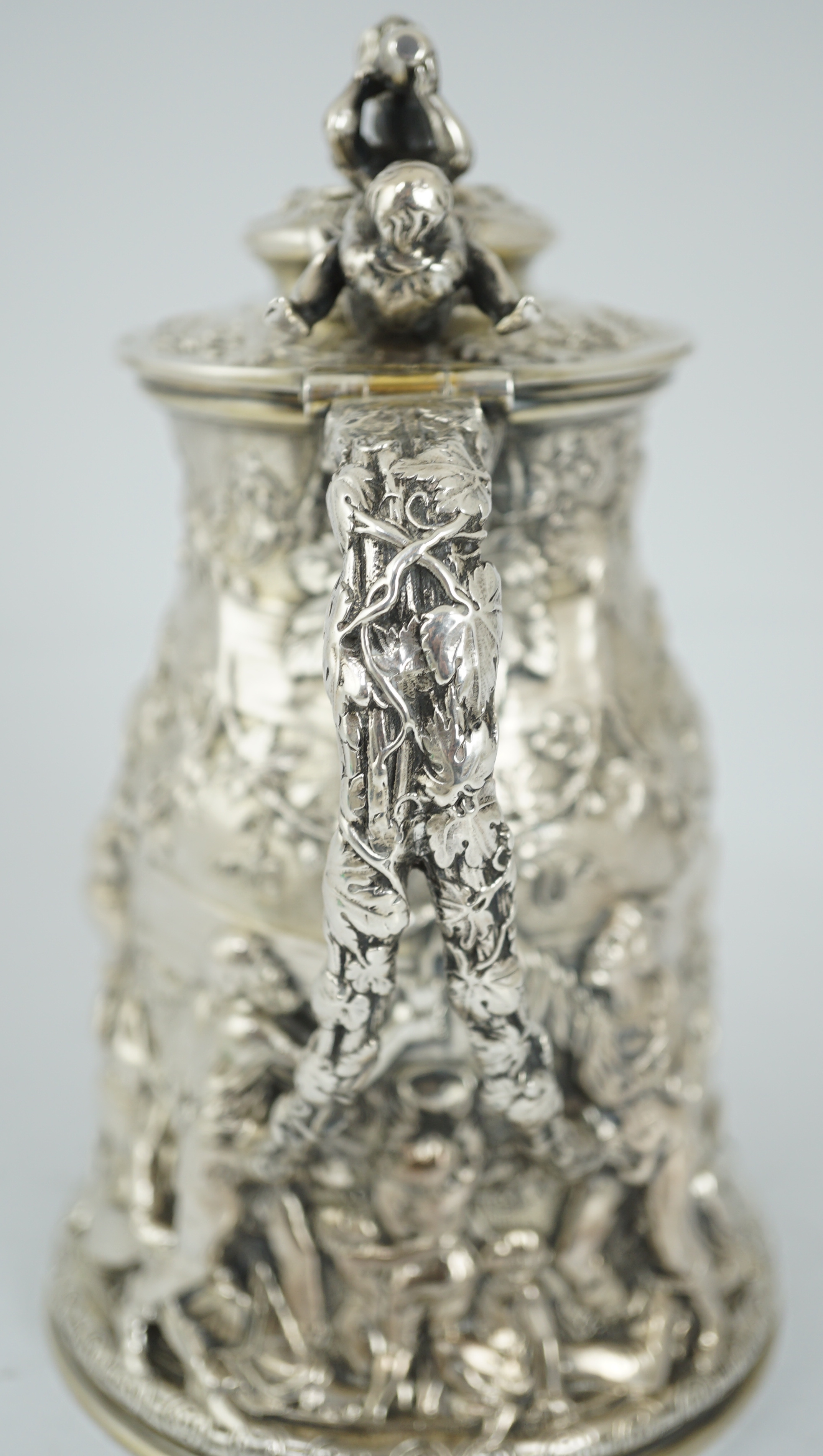 ROYAL INTEREST: A good ornate Victorian Teniers style silver ewer with hinged cover by Frederick Elkington